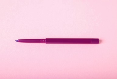 Photo of One twist up eye pencil on pink background