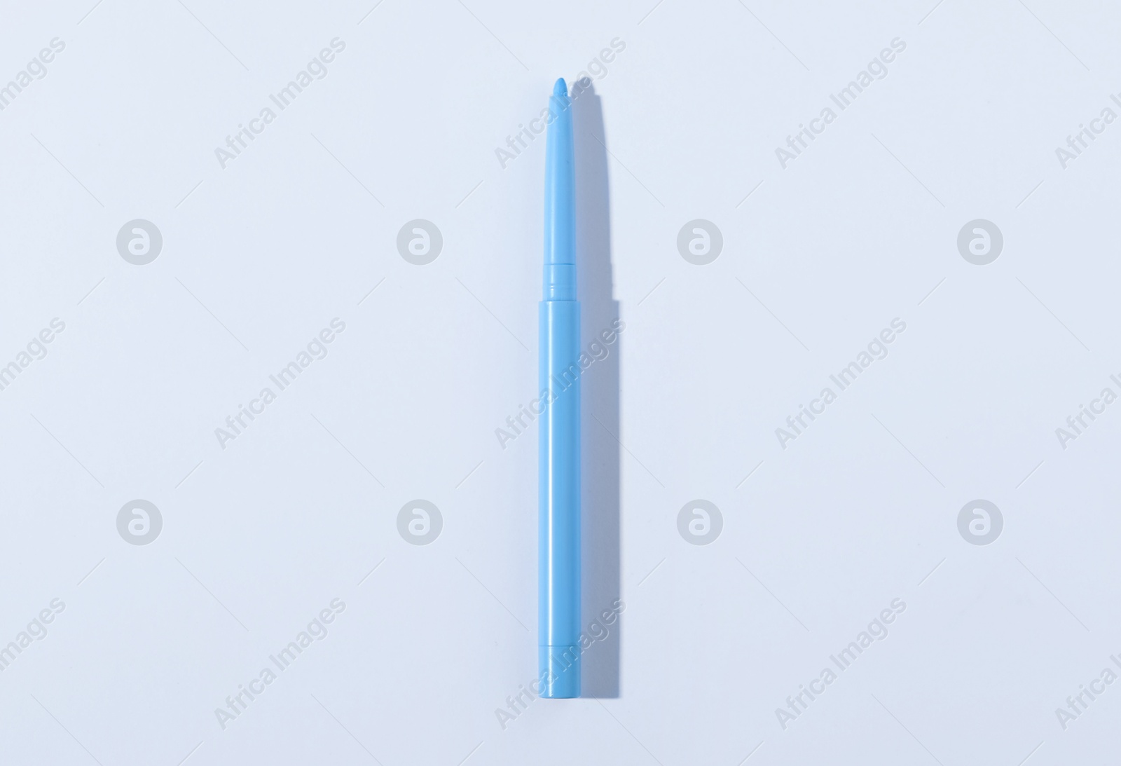 One twist up eye pencil on white background, top view Photo of One twist up eye pencil on white background, top view