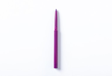 Photo of One twist up eye pencil on white background, top view