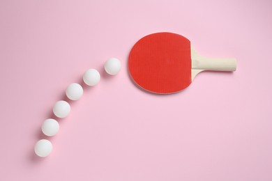 Photo of Ping pong racket and balls on pink background, flat lay