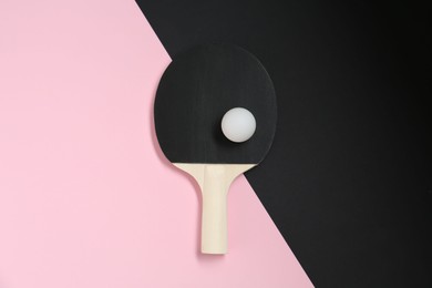 Photo of Ping pong racket and ball on color background, top view