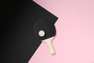 Photo of Ping pong racket and ball on color background, top view