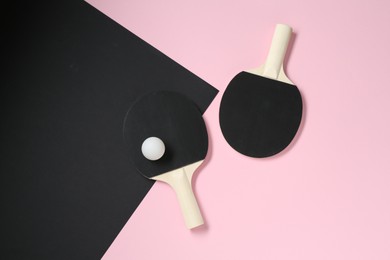 Photo of Ping pong rackets and ball on color background, flat lay