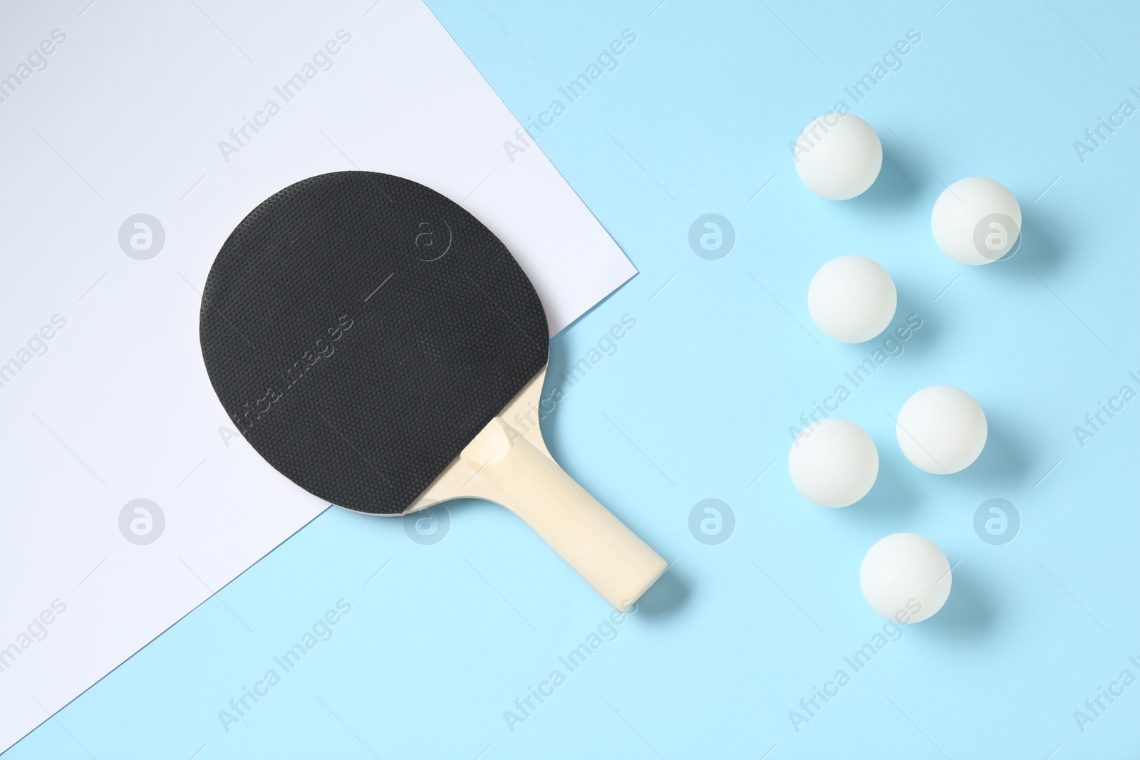 Ping pong racket and balls on color background, flat lay Photo of Ping pong racket and balls on color background, flat lay