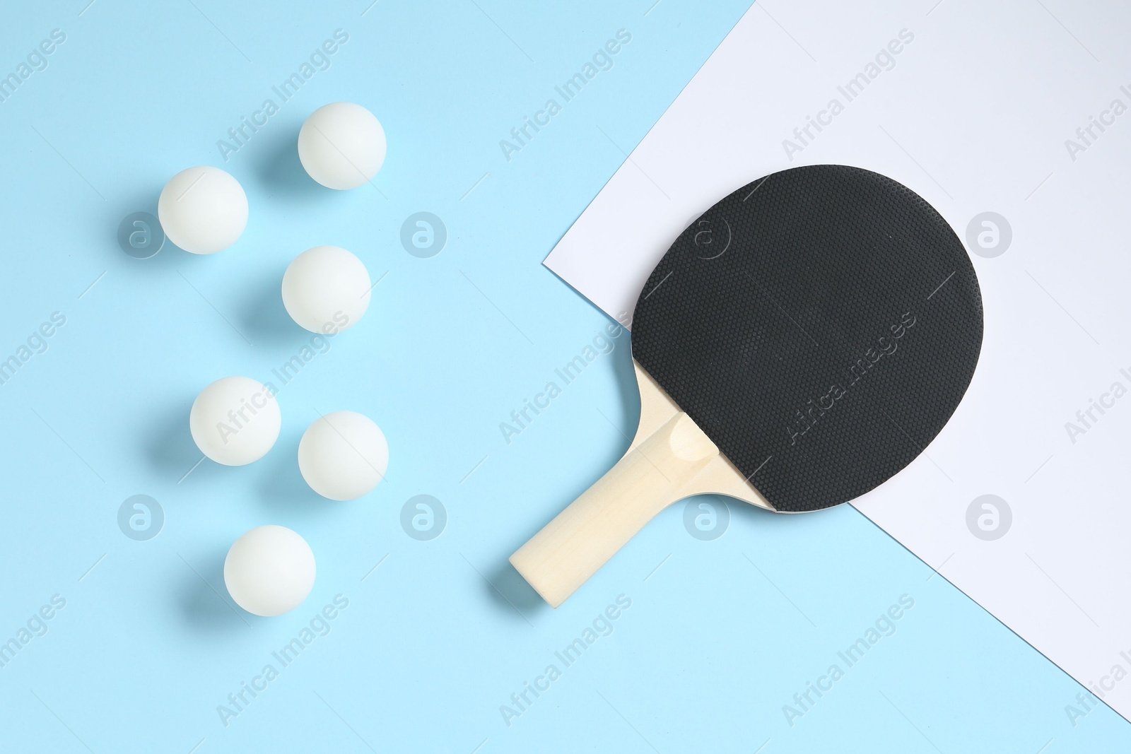 Ping pong racket and balls on color background, flat lay Photo of Ping pong racket and balls on color background, flat lay