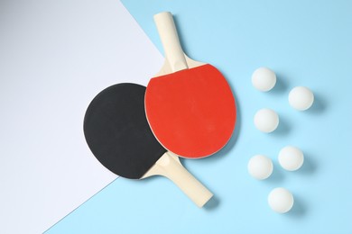 Photo of Ping pong rackets and balls on color background, flat lay