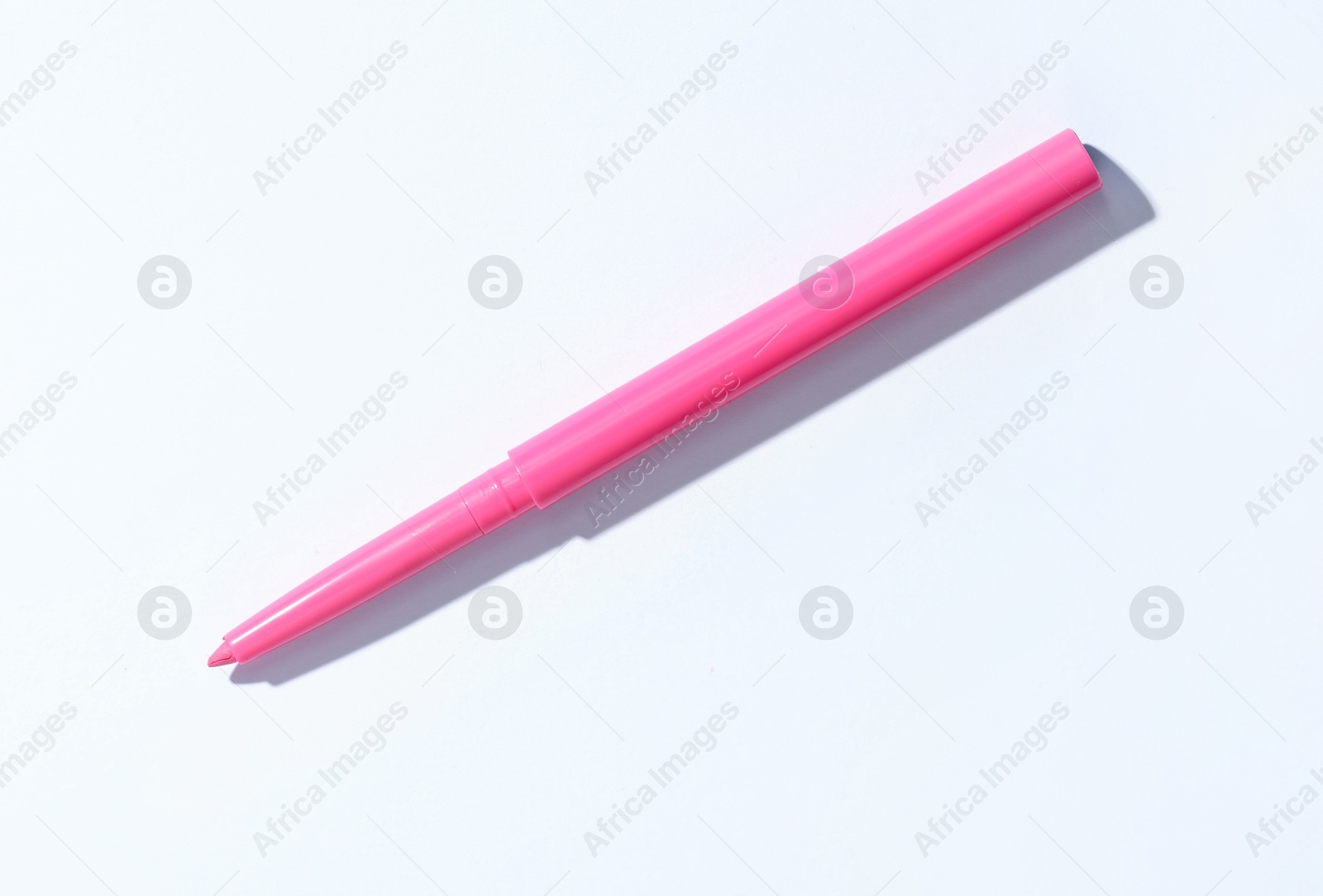 One twist up eye pencil on white background, top view Photo of One twist up eye pencil on white background, top view