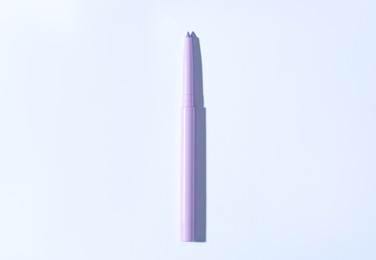 Photo of One twist up eye pencil on white background, top view