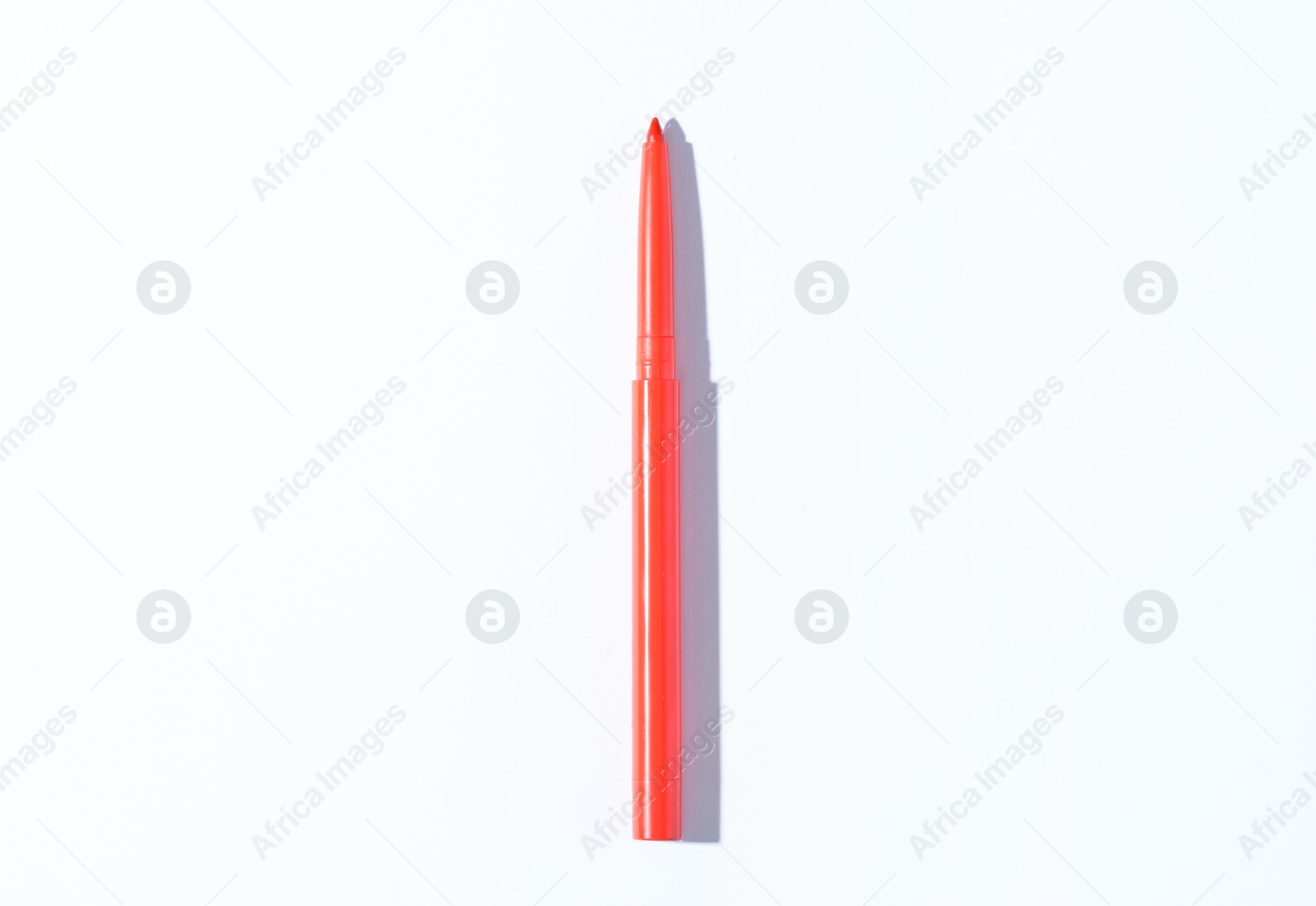 One twist up eye pencil on white background, top view Photo of One twist up eye pencil on white background, top view