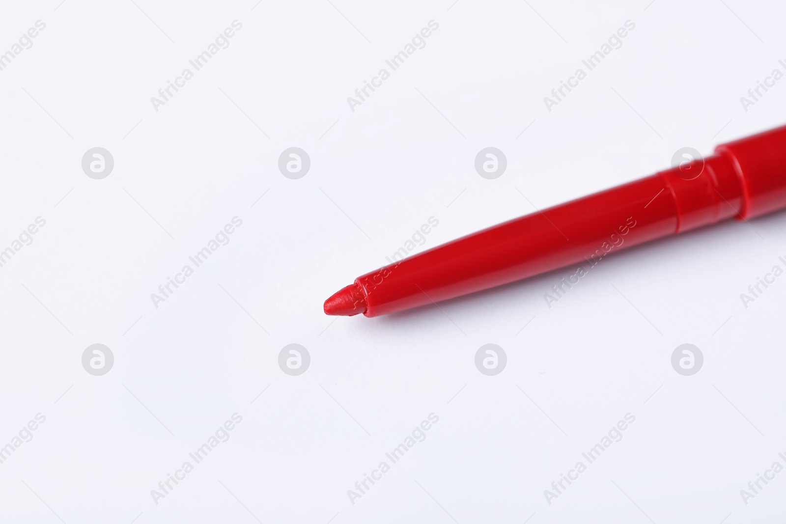 One twist up eye pencil on white background, closeup. Space for text Photo of One twist up eye pencil on white background, closeup. Space for text