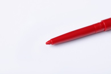 Photo of One twist up eye pencil on white background, closeup. Space for text