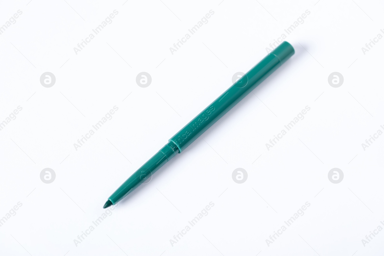 One twist up eye pencil on white background, above view Photo of One twist up eye pencil on white background, above view
