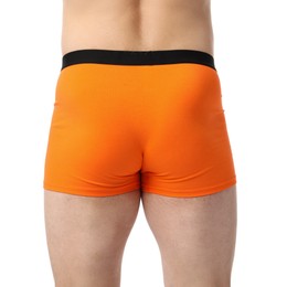 Photo of Young man in stylish orange underwear on white background, closeup