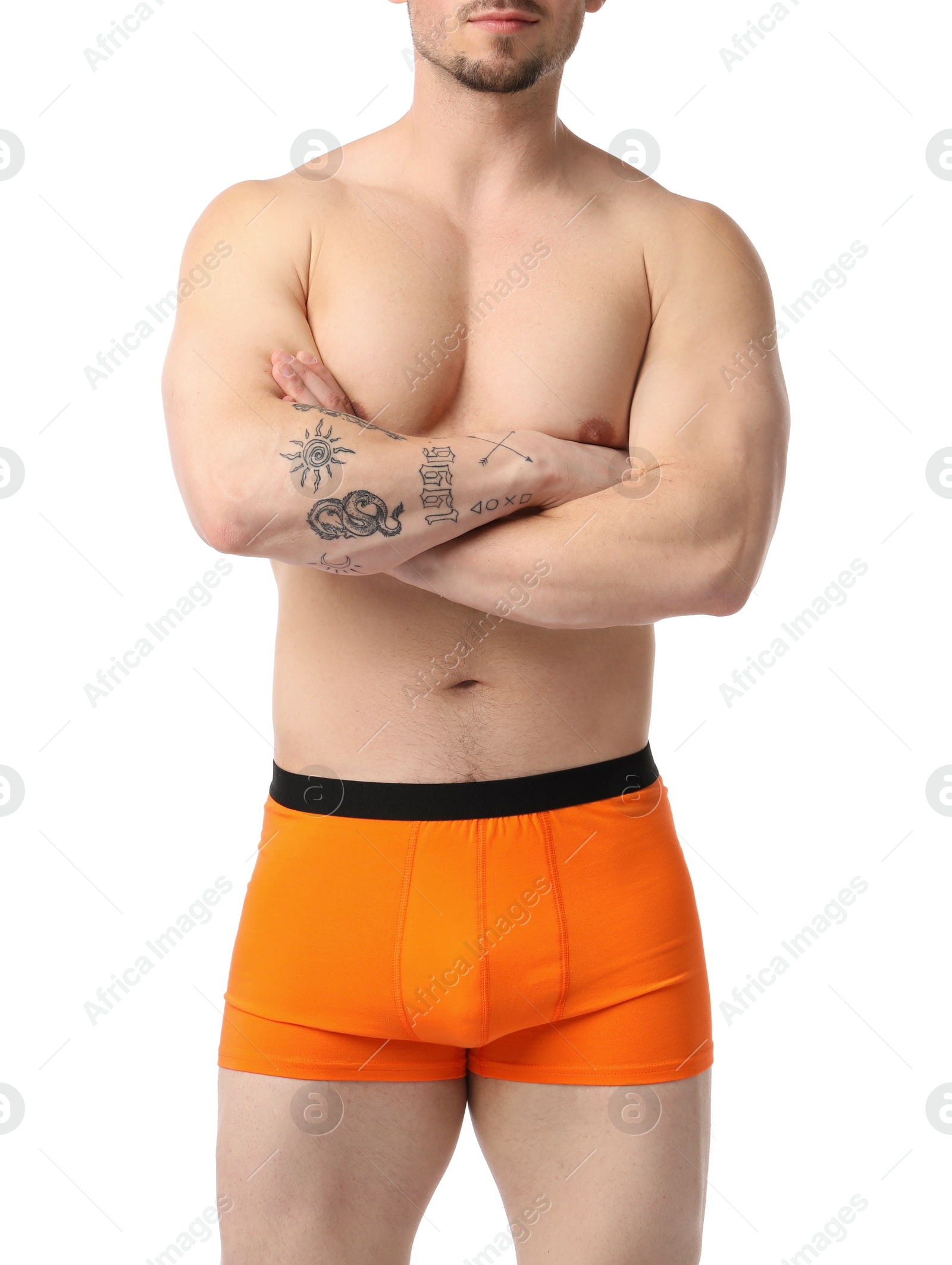 Young man in stylish orange underwear on white background, closeup Photo of Young man in stylish orange underwear on white background, closeup