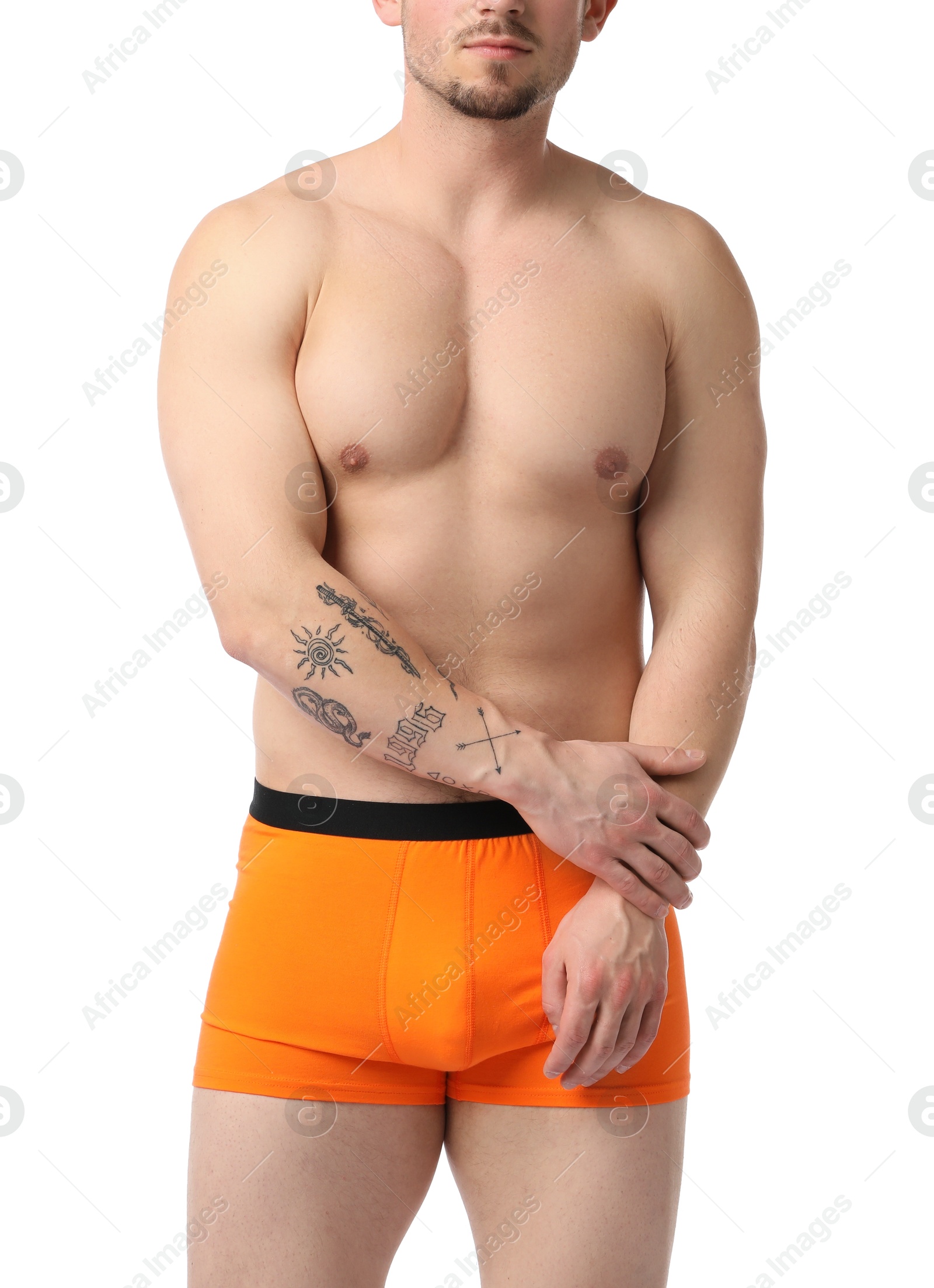 Young man in stylish orange underwear on white background, closeup Photo of Young man in stylish orange underwear on white background, closeup