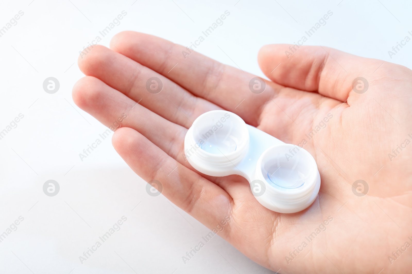 Woman with contact lenses on light background, closeup Photo of Woman with contact lenses on light background, closeup