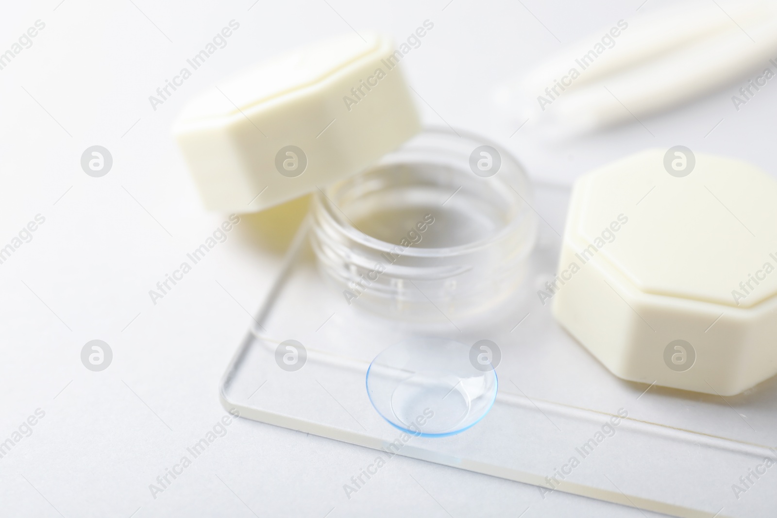 Case with contact lenses on white background, closeup Photo of Case with contact lenses on white background, closeup