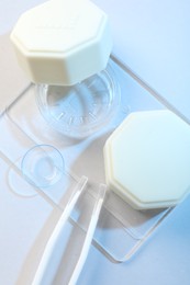 Photo of Case with contact lenses on white background, top view