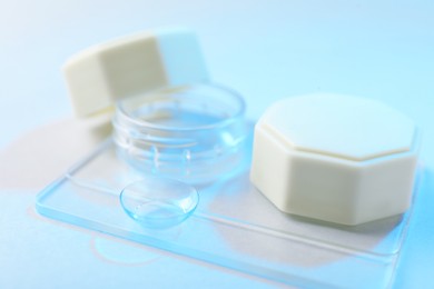 Photo of Case with contact lenses on white background, closeup