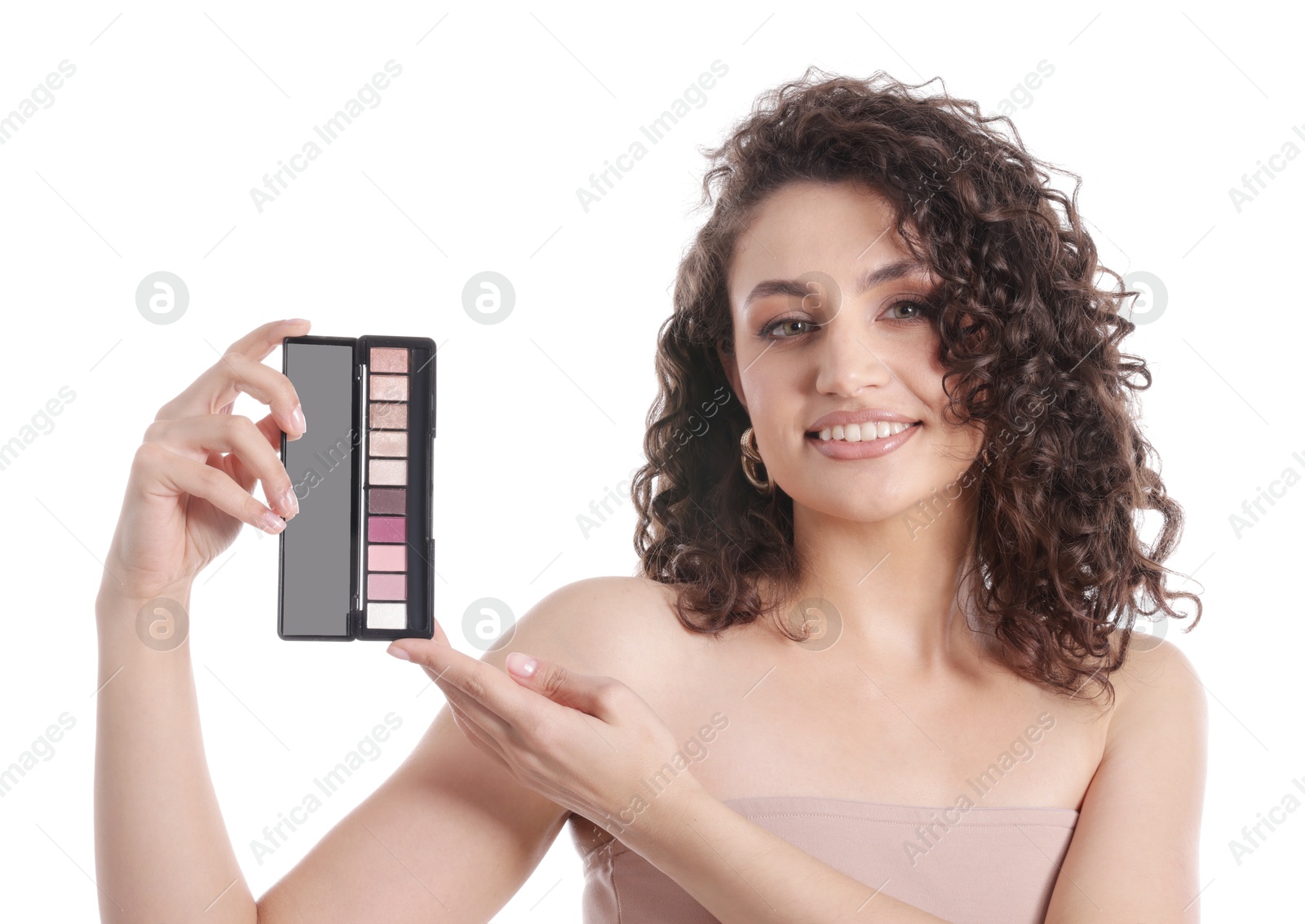 Smiling woman with eyeshadow palette on white background Photo of Smiling woman with eyeshadow palette on white background