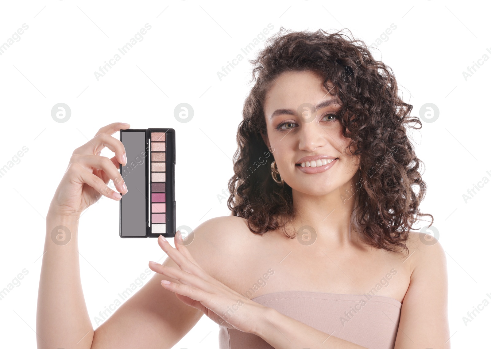 Smiling woman with eyeshadow palette on white background Photo of Smiling woman with eyeshadow palette on white background