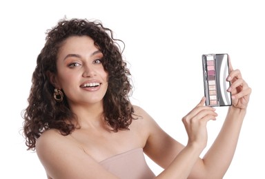 Photo of Smiling woman with eyeshadow palette on white background