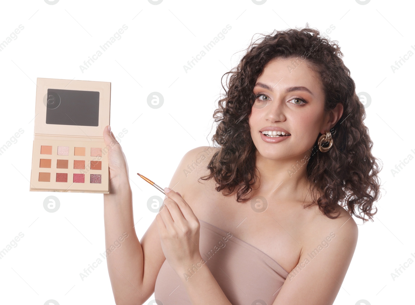 Woman with eyeshadow palette and brush on white background Photo of Woman with eyeshadow palette and brush on white background
