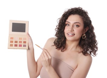 Photo of Woman with eyeshadow palette and brush on white background