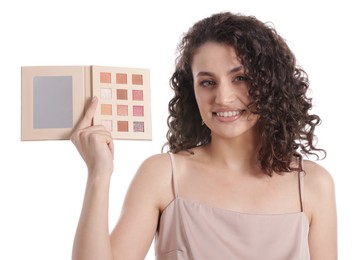 Photo of Smiling woman with eyeshadow palette on white background