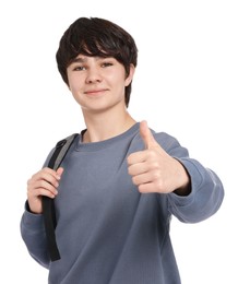 Photo of Teenage boy with backpack showing thumbs up on white background