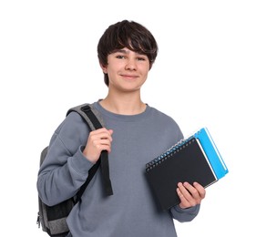 Photo of Teenage boy with backpack and notebooks on white background