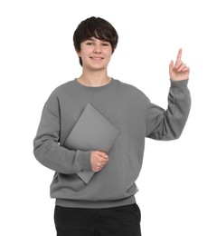 Photo of Teenage boy with laptop on white background