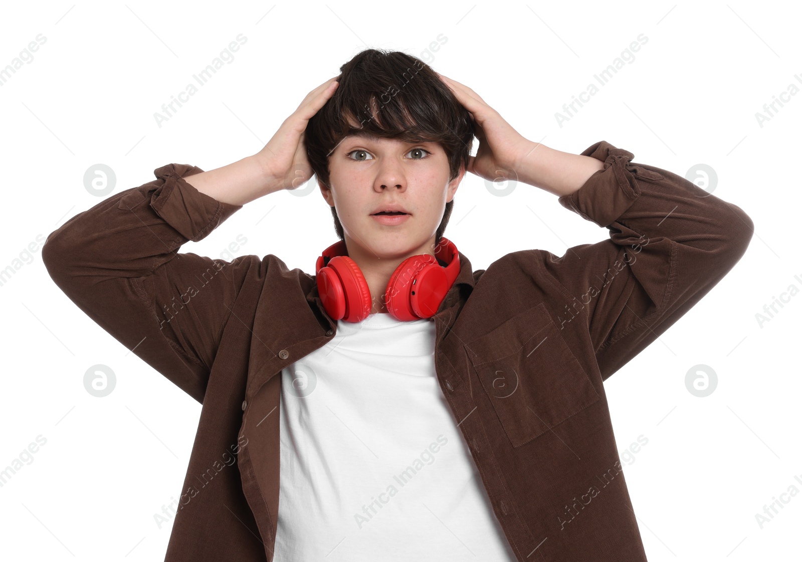 Teenage boy with headphones on white background Photo of Teenage boy with headphones on white background