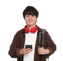 Photo of Teenage boy with backpack, headphones and smartphone on white background