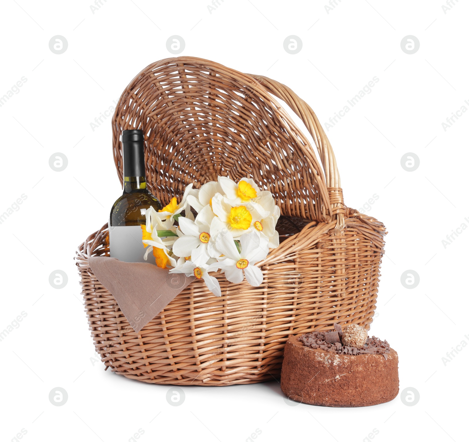 Picnic wicker basket with beautiful flowers, bottle of wine and cake isolated on white Photo of Picnic wicker basket with beautiful flowers, bottle of wine and cake isolated on white