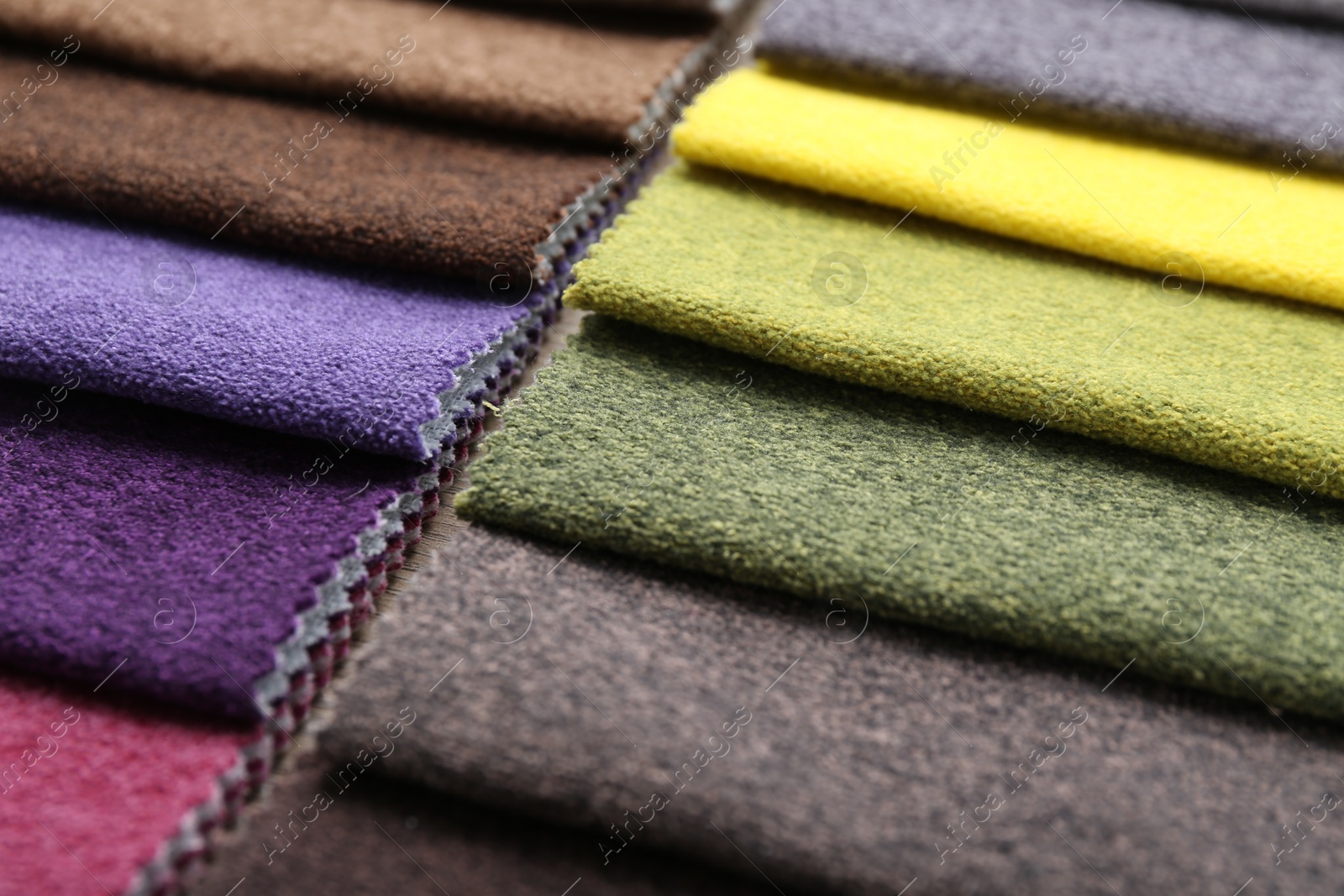 Samples of different fabrics as background, closeup Photo of Samples of different fabrics as background, closeup
