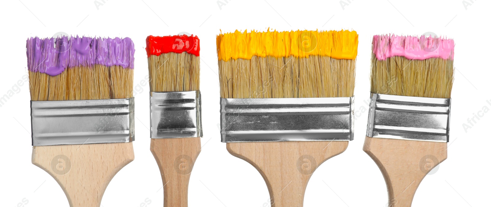 Brushes with different paints isolated on white Photo of Brushes with different paints isolated on white