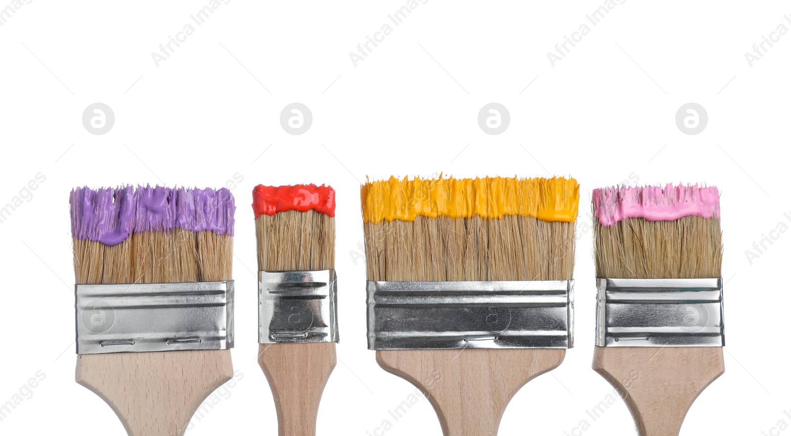 Brushes with different paints isolated on white Photo of Brushes with different paints isolated on white