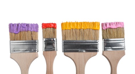 Photo of Brushes with different paints isolated on white