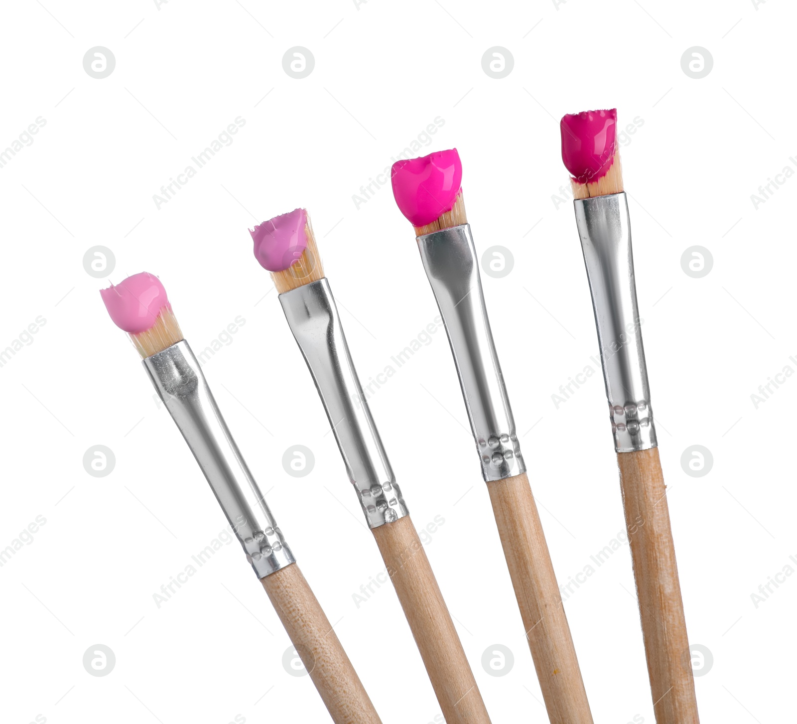 Brushes with different paints isolated on white Photo of Brushes with different paints isolated on white