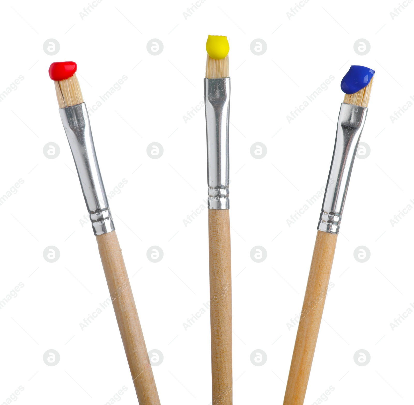 Brushes with different paints isolated on white Photo of Brushes with different paints isolated on white