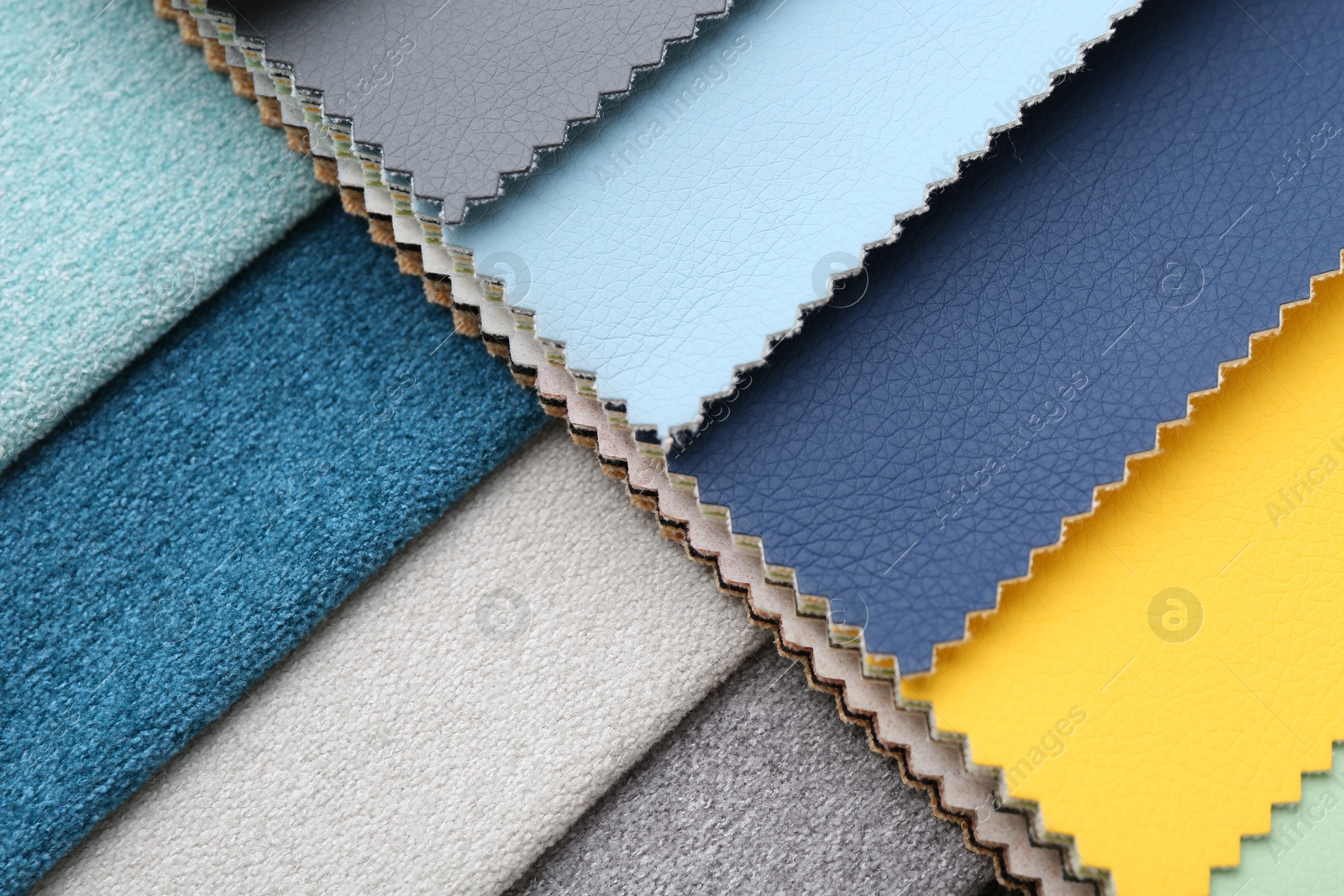 Samples of different fabrics as background, closeup Photo of Samples of different fabrics as background, closeup