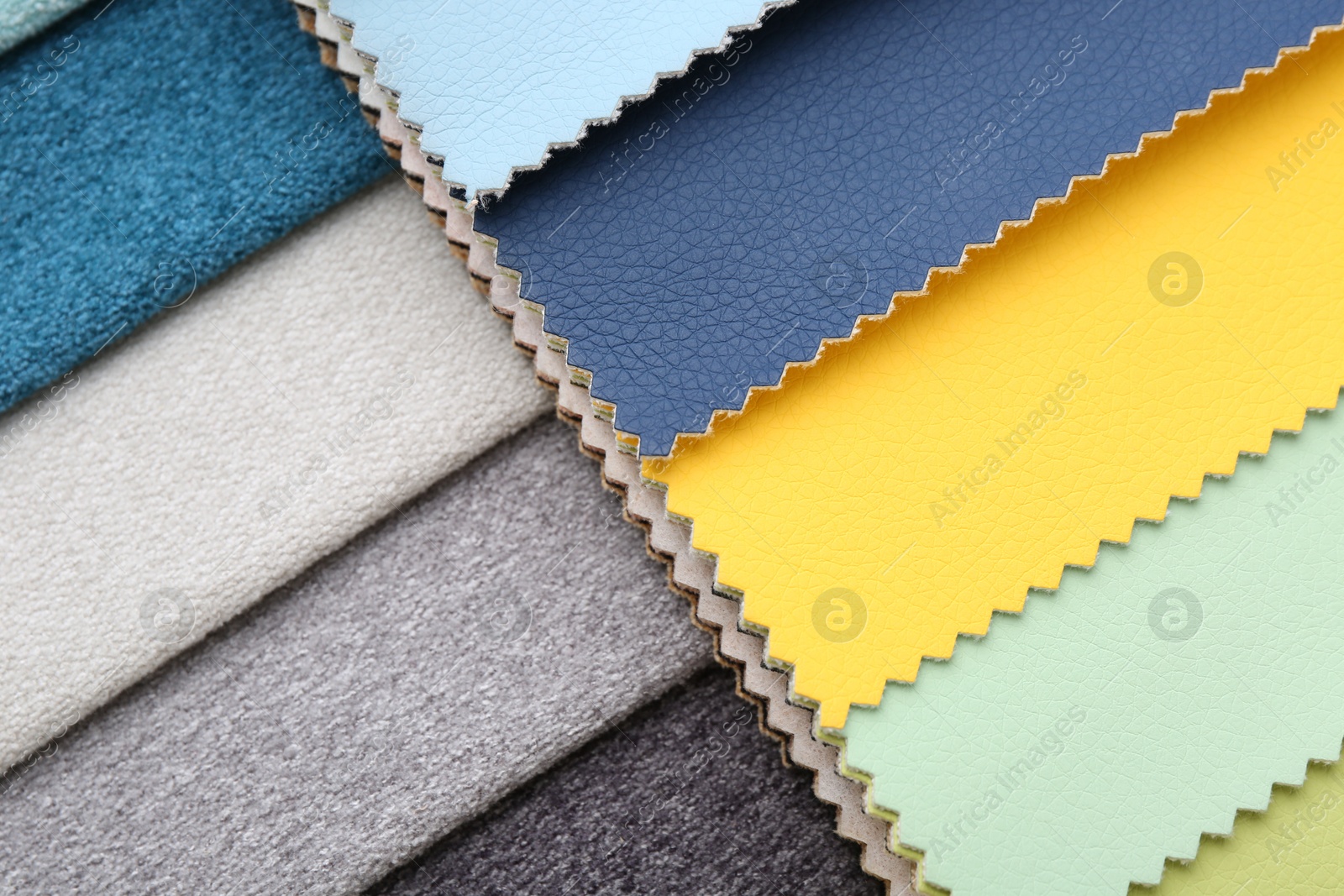 Samples of different fabrics as background, top view Photo of Samples of different fabrics as background, top view