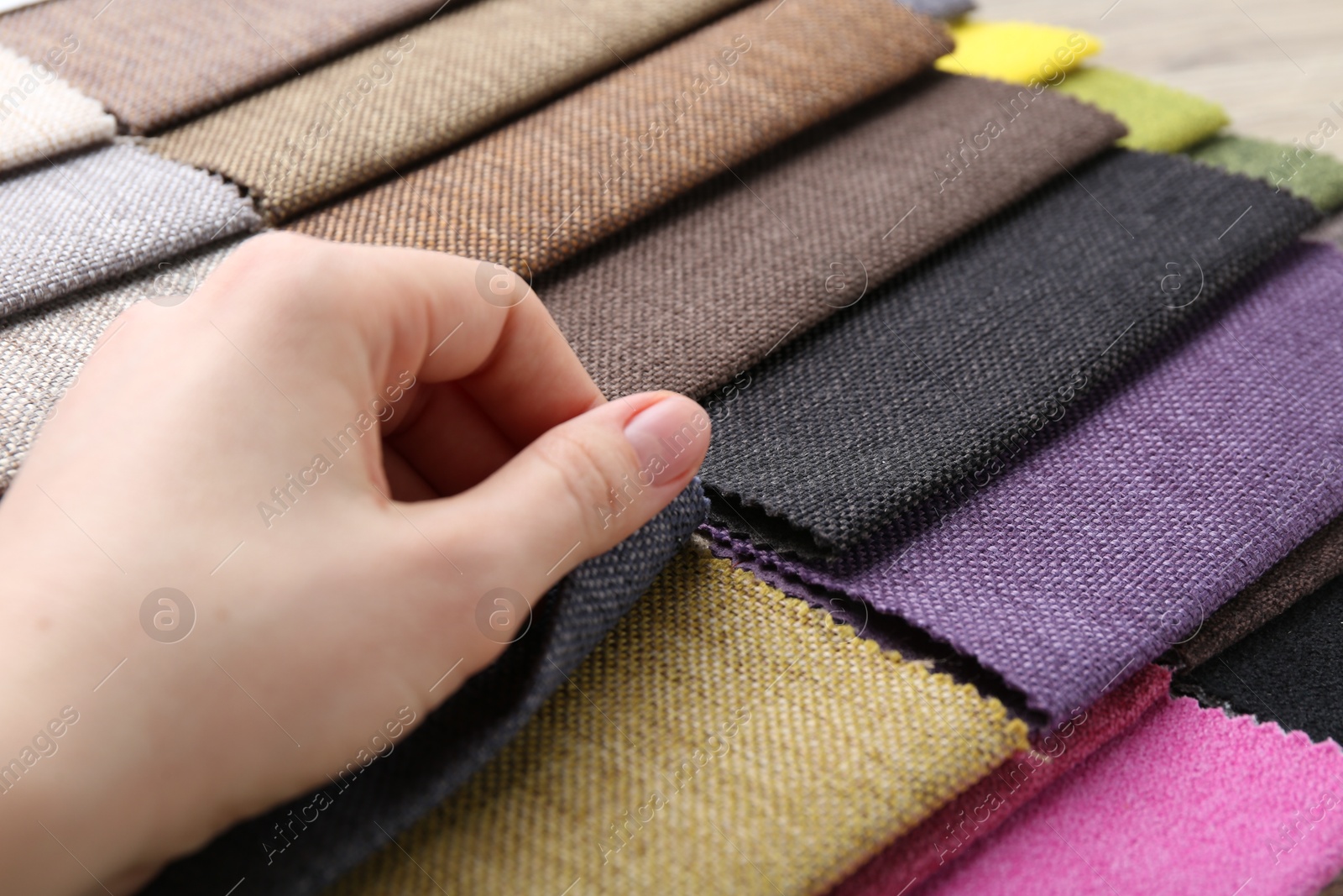 Woman with samples of different fabrics, closeup Photo of Woman with samples of different fabrics, closeup