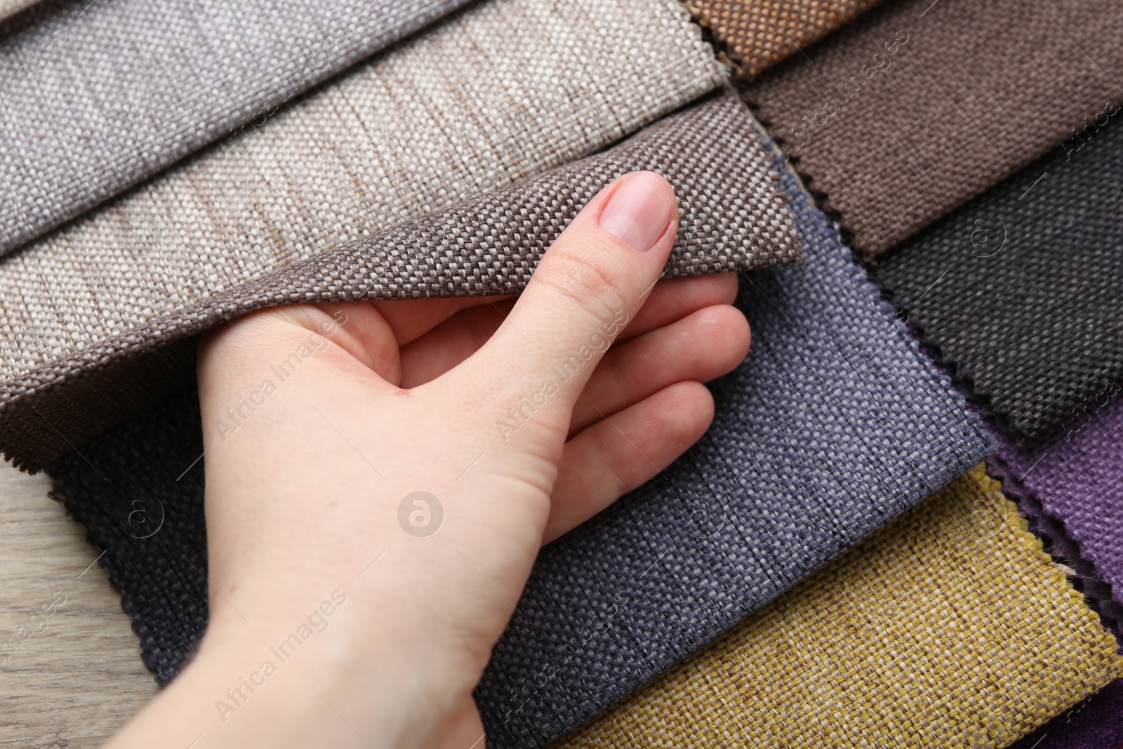 Woman with samples of different fabrics, closeup Photo of Woman with samples of different fabrics, closeup