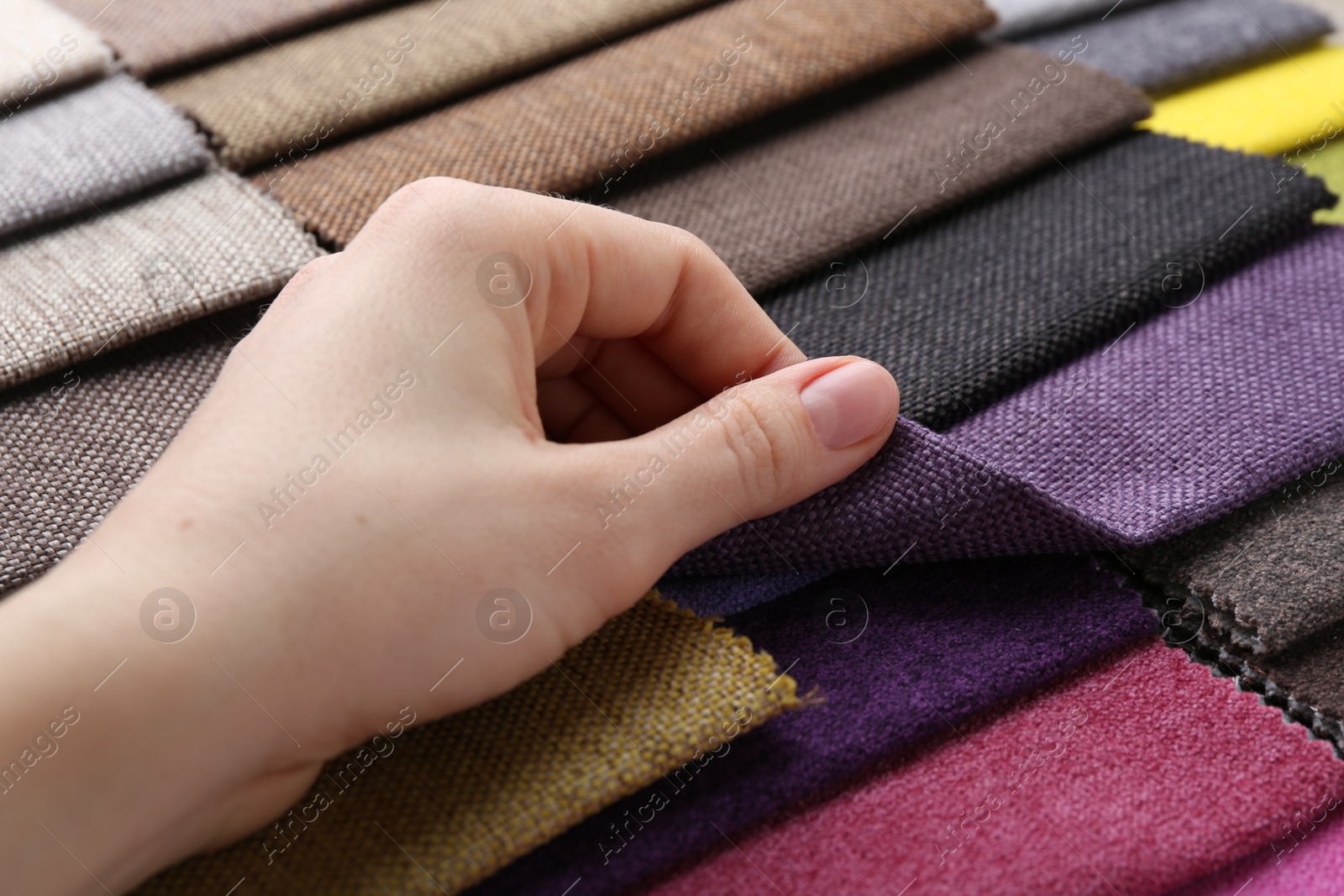 Woman with samples of different fabrics, closeup Photo of Woman with samples of different fabrics, closeup