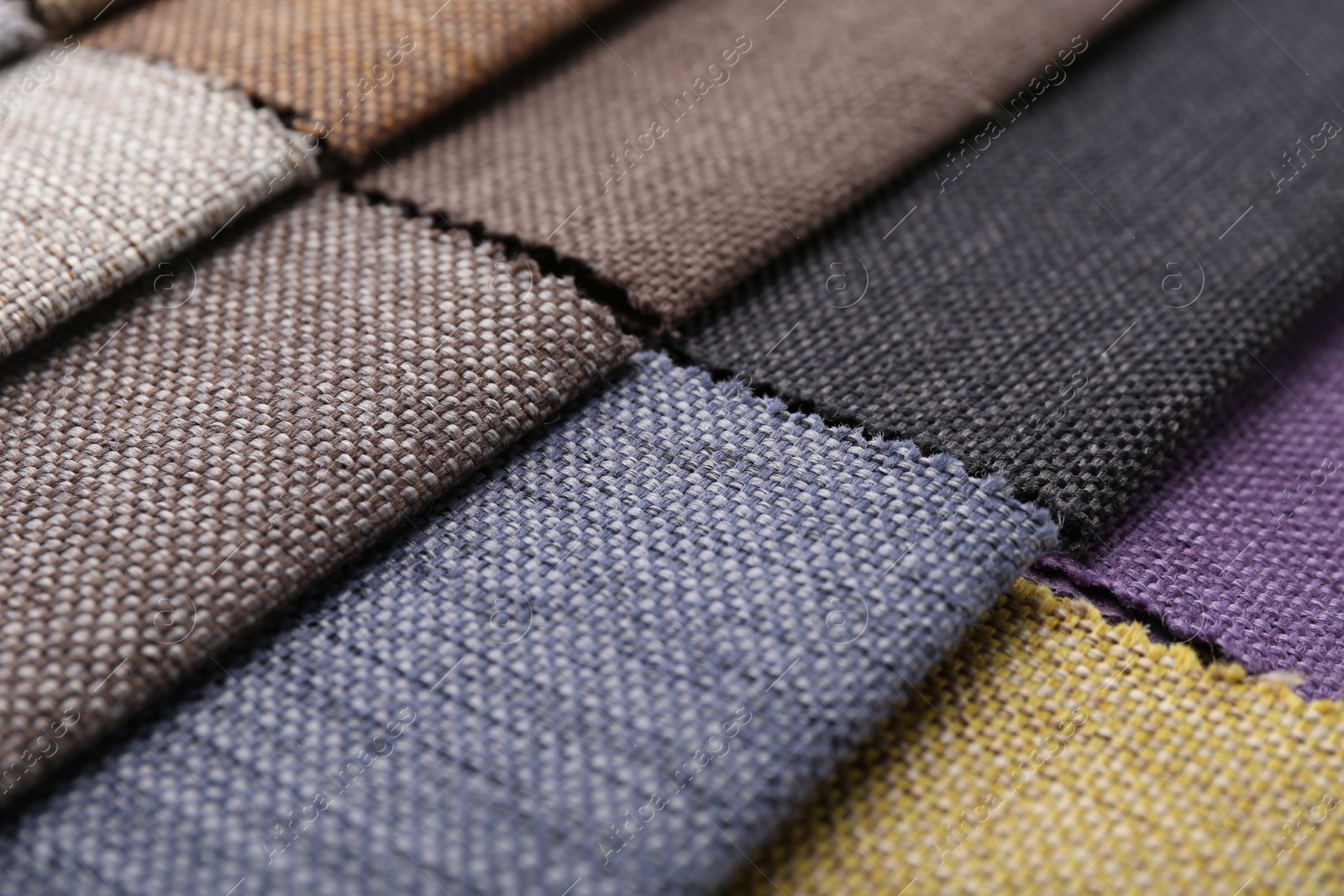 Samples of different fabrics as background, closeup Photo of Samples of different fabrics as background, closeup