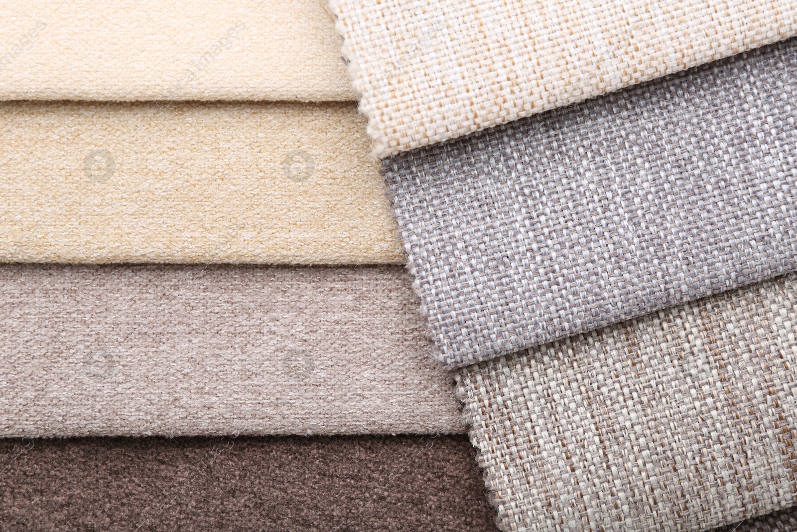 Samples of different fabrics as background, top view Photo of Samples of different fabrics as background, top view