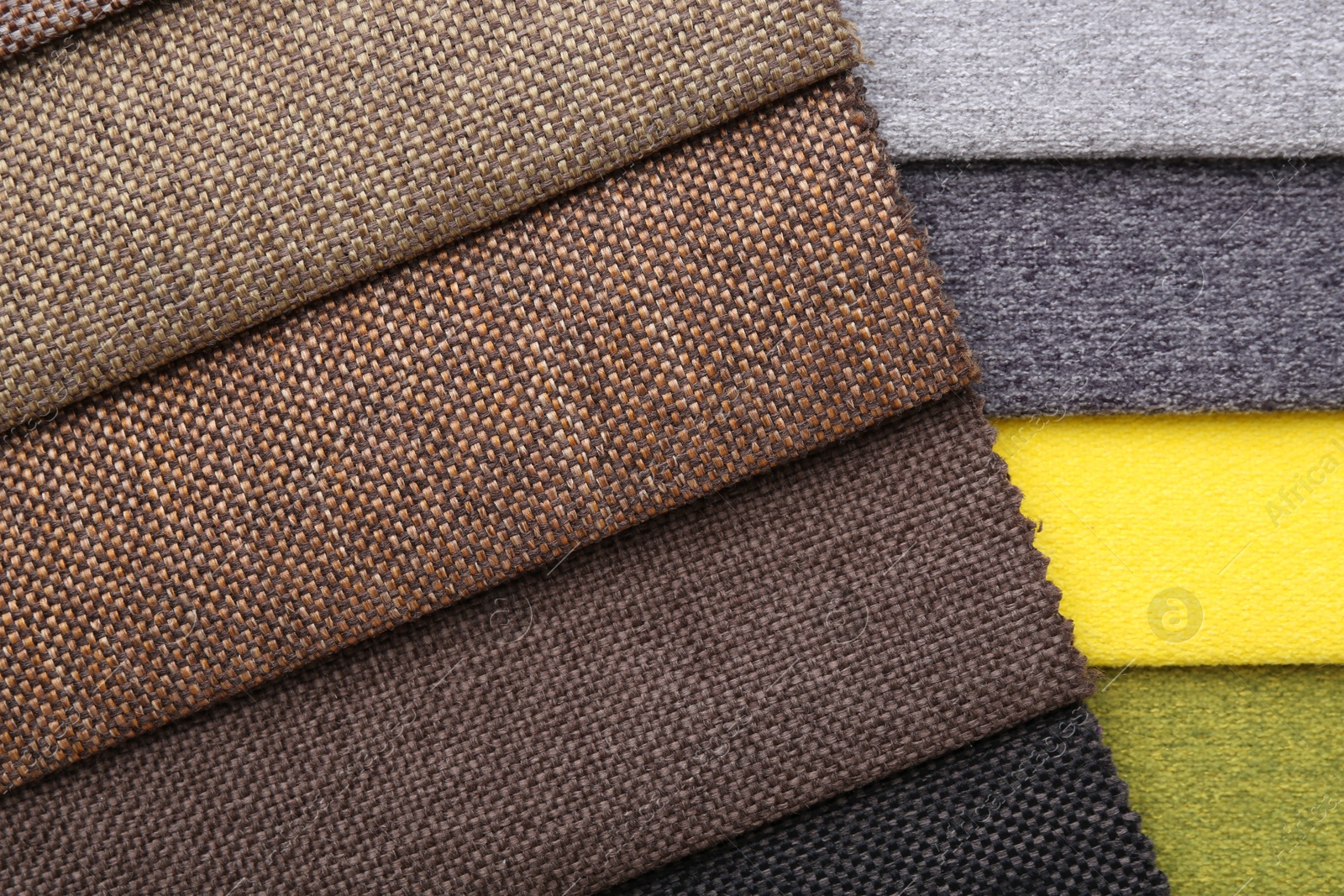 Samples of different fabrics as background, top view Photo of Samples of different fabrics as background, top view
