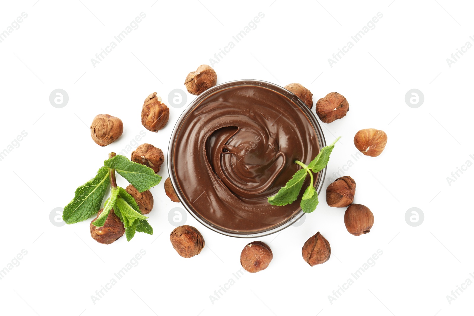 Tasty chocolate spread with mint in bowl and hazelnuts isolated on white, top view Photo of Tasty chocolate spread with mint in bowl and hazelnuts isolated on white, top view